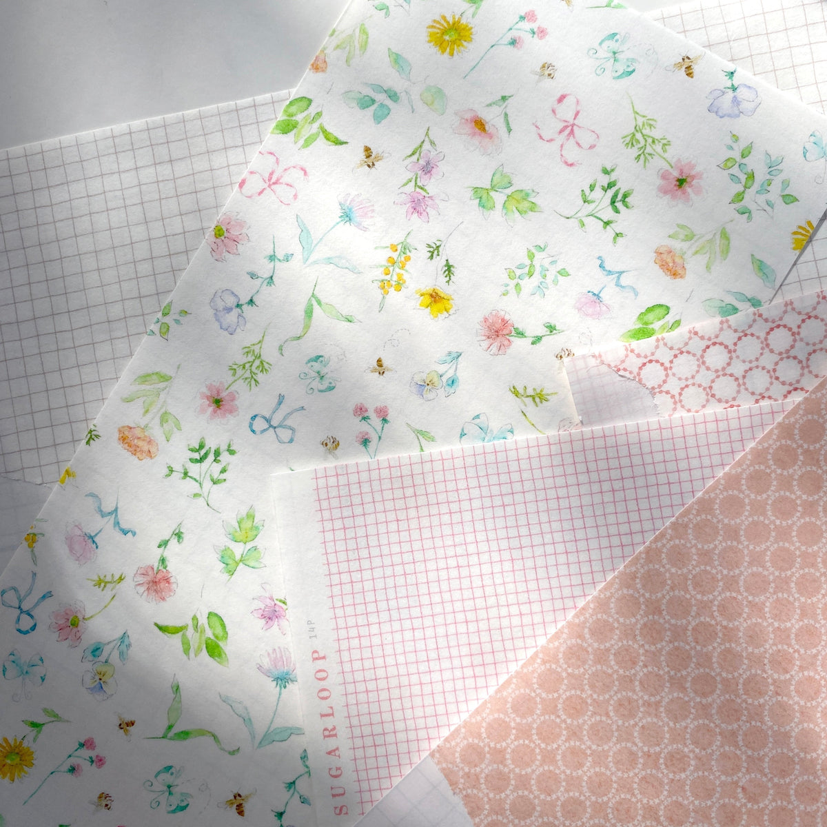 Self adhesive washi paper pattern sheet - on a pile displaying all patterns
